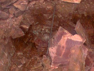 A small corner of the quarry, it looks pretty much like a Pipestone quarry, with the prybar there, until you realise that this is there to break a way into the softer layer of stone, which is called 'undermining'. 