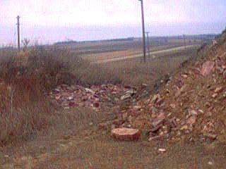 pile of stone next to the big pile of earth and rock